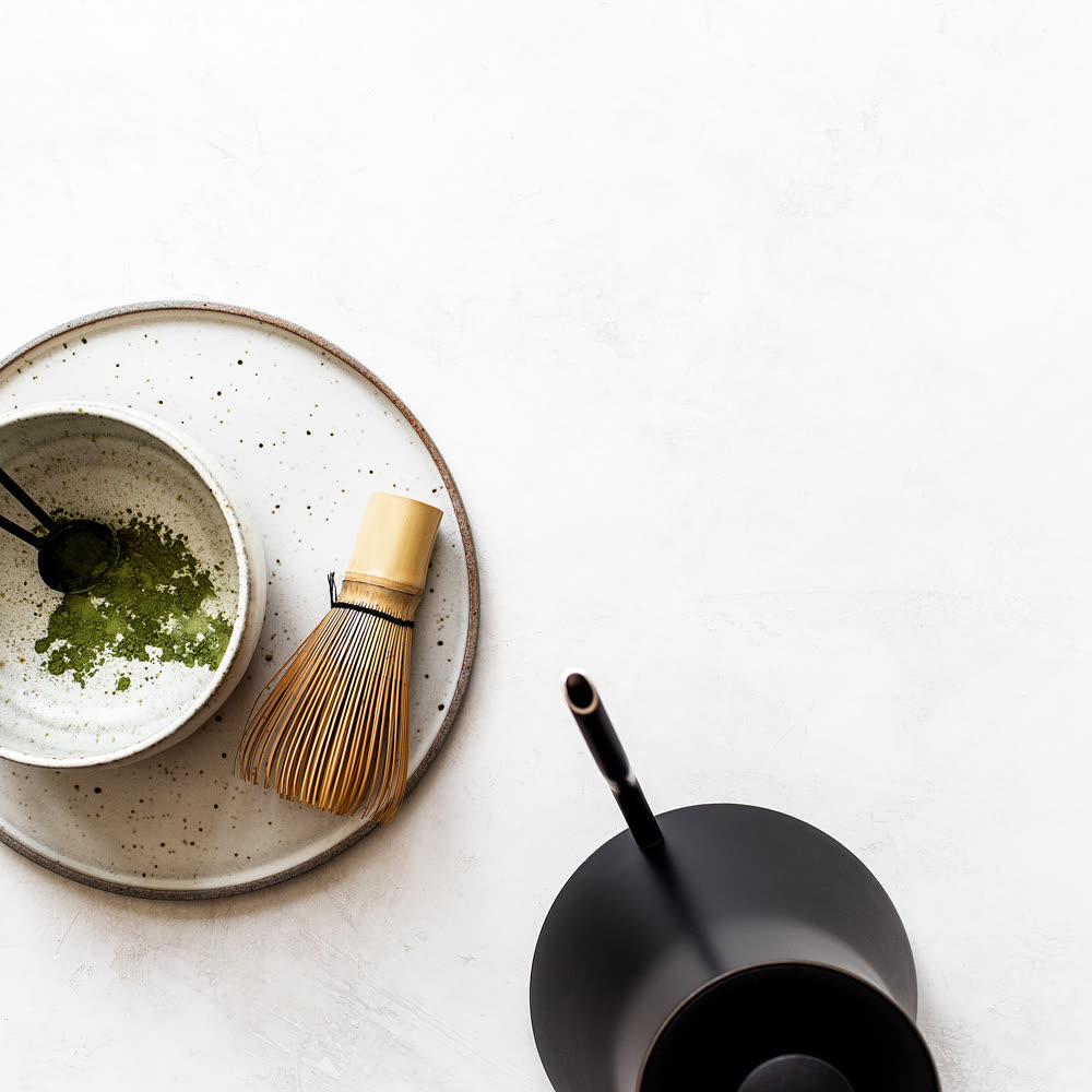 Matcha bowl and whisk on a stone table